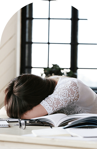 business-burnout Woman sleeping at desk