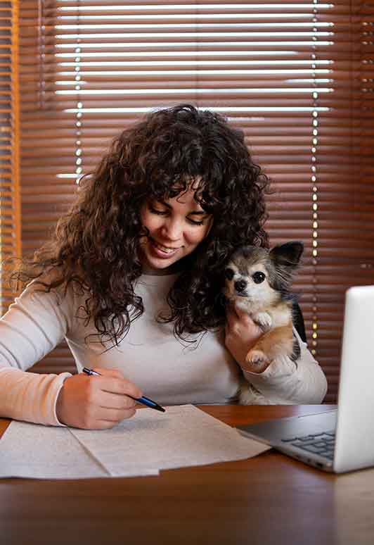 Woman with dog writing